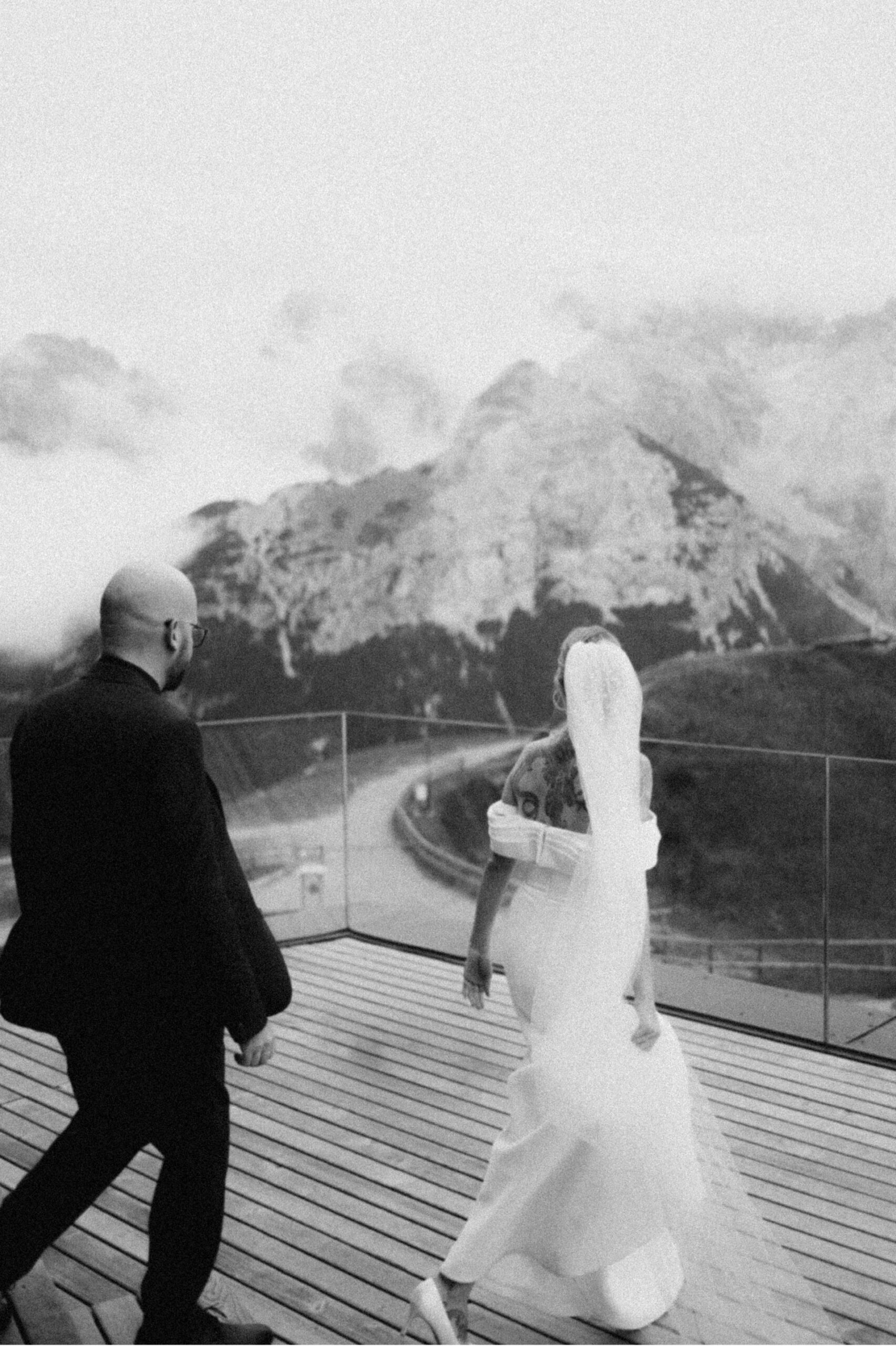 Intimate Dolomites wedding surrounded by clouds and mountain peaks