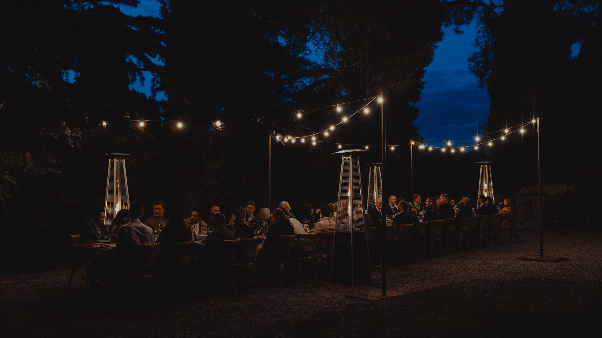Bride and groom celebrating with their guests during their Tuscany wedding reception